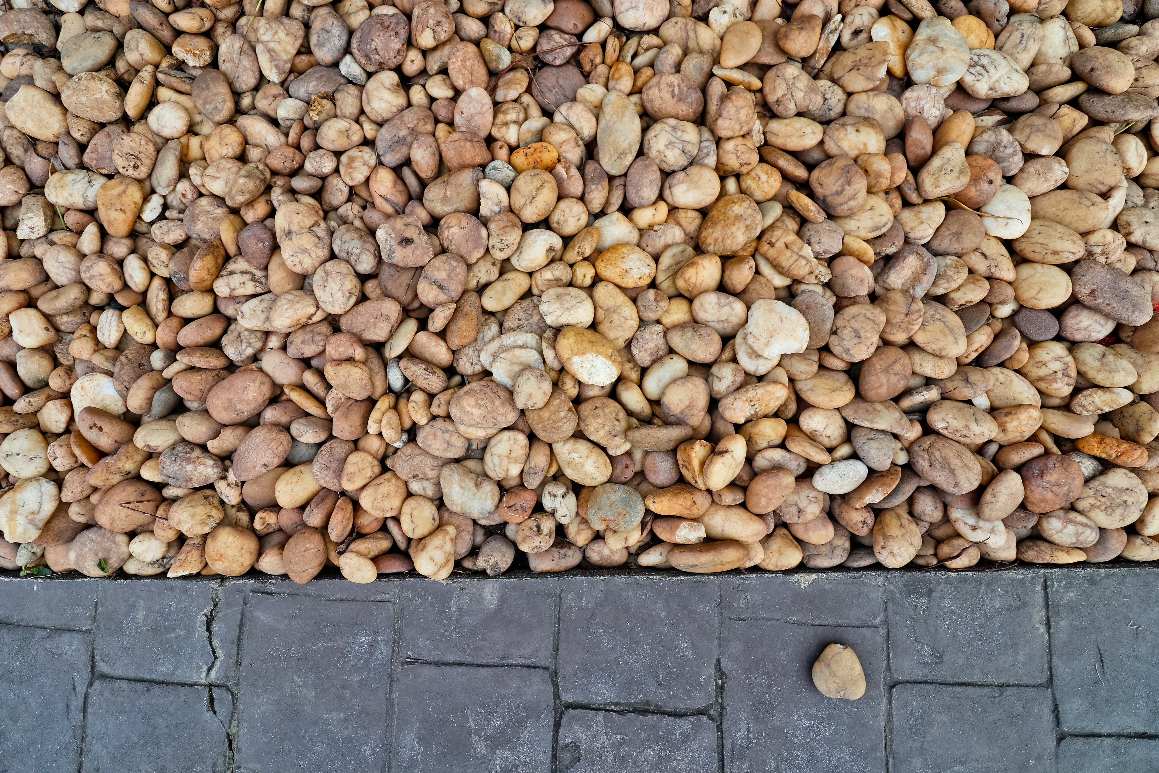Abstract background: Decorative floor pattern of small gravel and seamless stones, Gravel texture